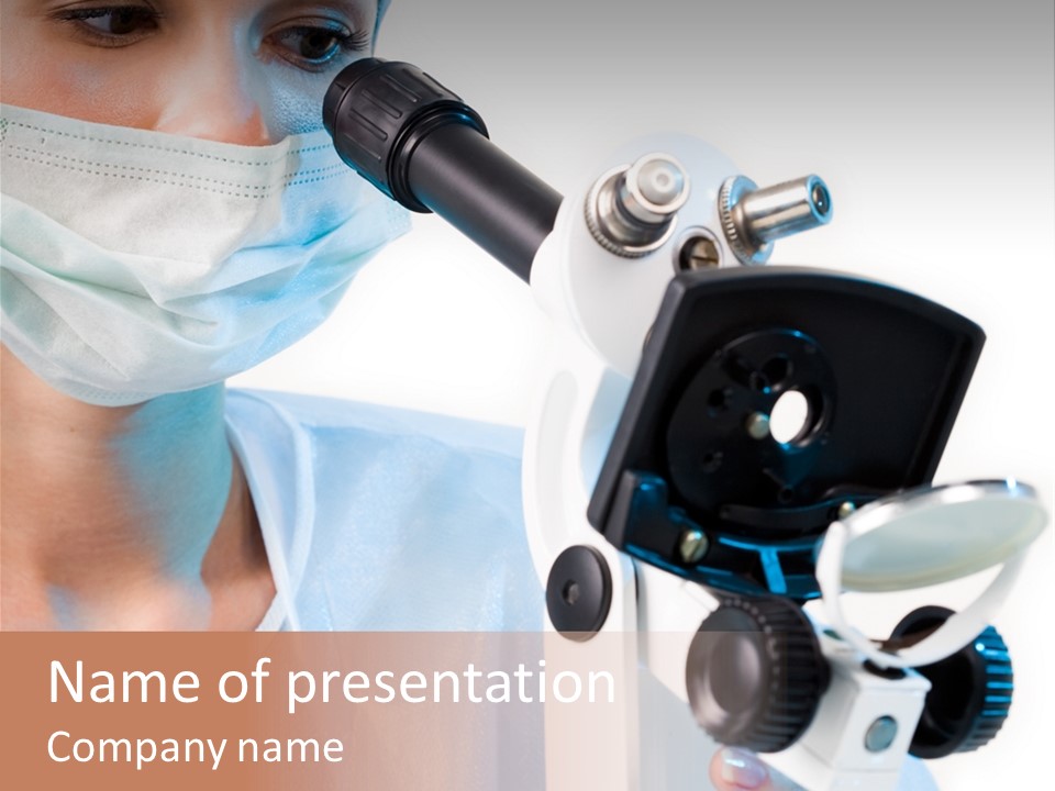 Portrait Of Medical Student Looking Through Microscope In Laboratory PowerPoint Template