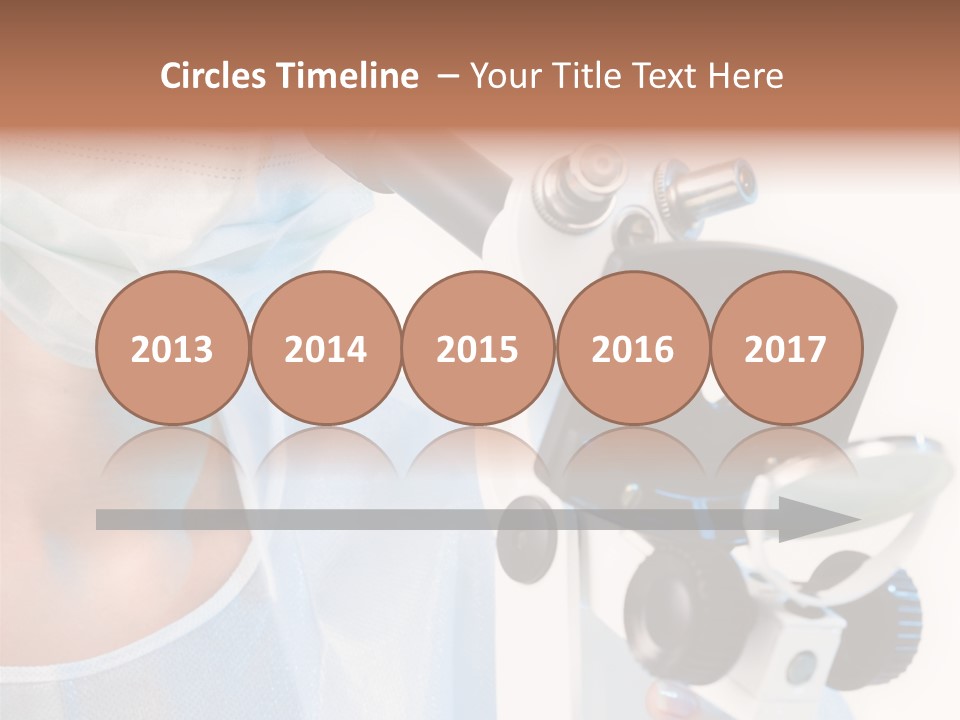 Portrait Of Medical Student Looking Through Microscope In Laboratory PowerPoint Template