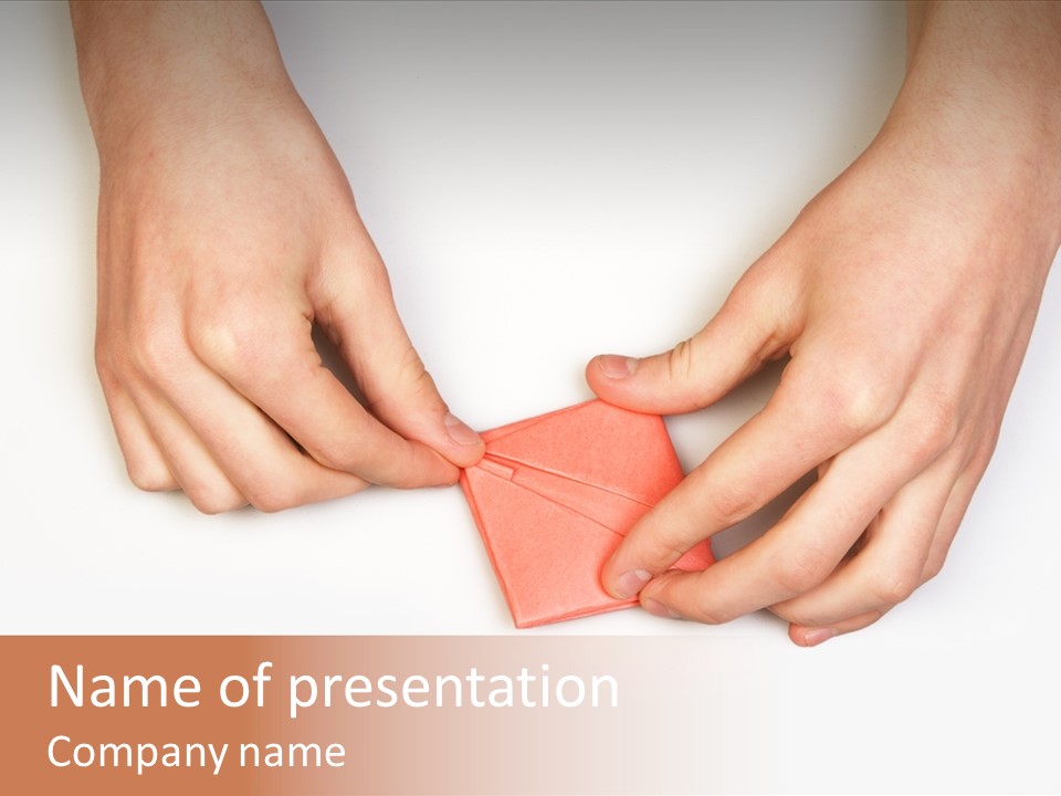 Two Hands Make Something From Sheet Of Paper PowerPoint Template