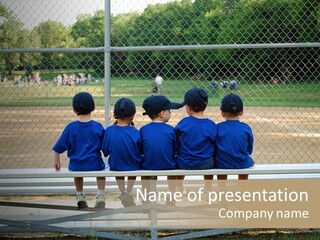Five Little Boys Sit On A Bench And Wait For Their Baseball / T-Ball Game To Begin PowerPoint Template