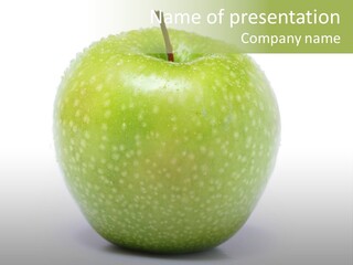 A Green Apple Sitting On Top Of A White Table PowerPoint Template