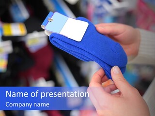 In Shop Hands Hold Socks With Space For Text PowerPoint Template