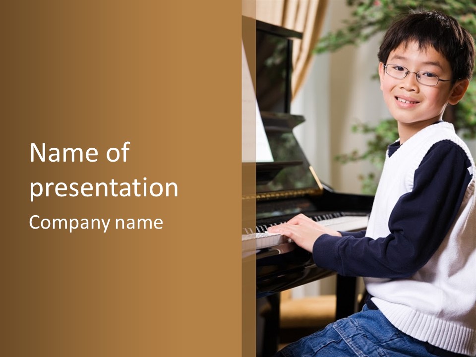 A Shot Of An Asian Boy Playing Piano PowerPoint Template