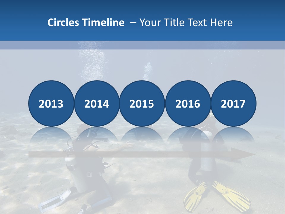 A Group Of People In Scuba Gear In The Water PowerPoint Template