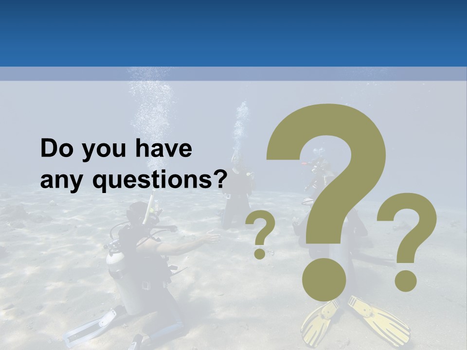 A Group Of People In Scuba Gear In The Water PowerPoint Template