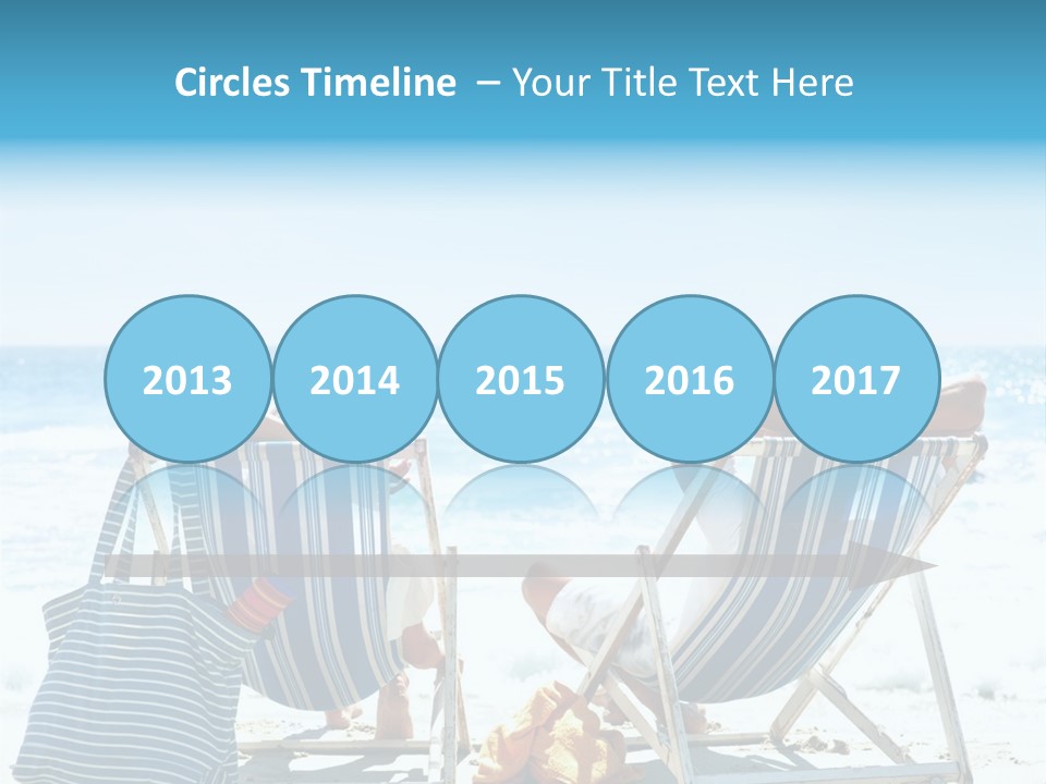 Two People Sitting In Beach Chairs On The Beach PowerPoint Template