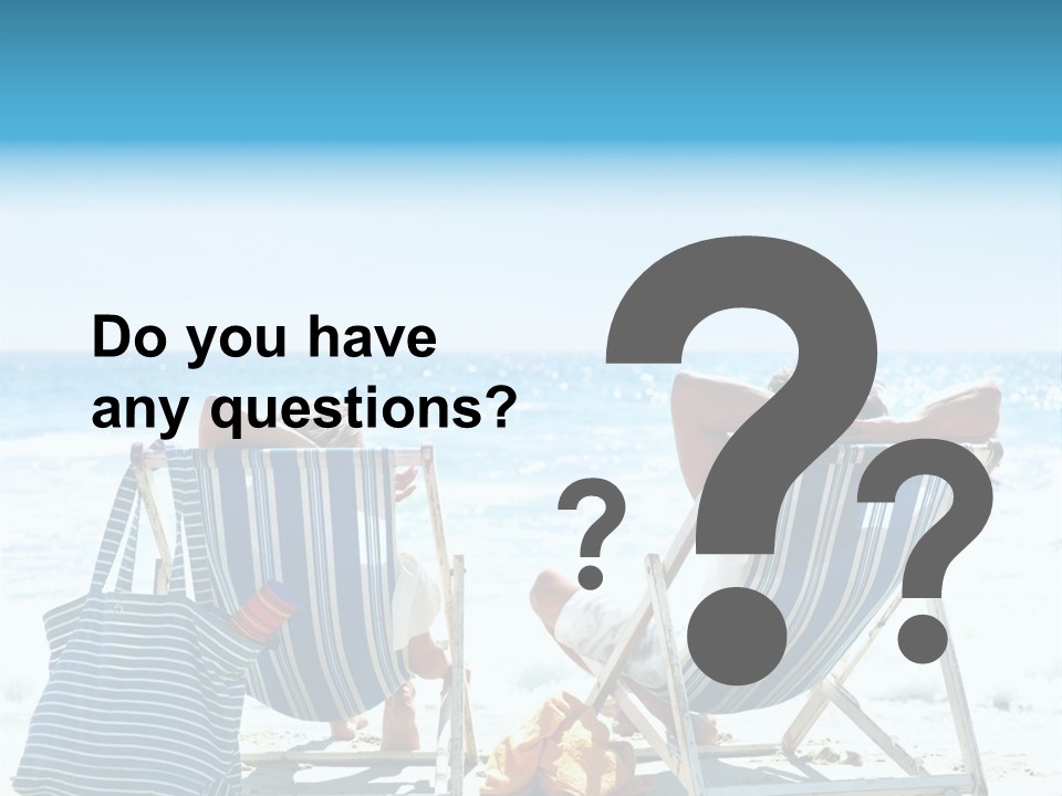 Two People Sitting In Beach Chairs On The Beach PowerPoint Template