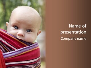 A Baby Is Wrapped In A Colorful Blanket PowerPoint Template