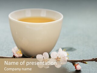 White Cup Of Tea And Apricot Flowers PowerPoint Template