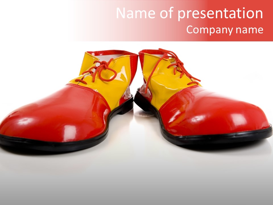 A Pair Of Huge Colorful Clown Shoes On A White Background With Copy Space PowerPoint Template