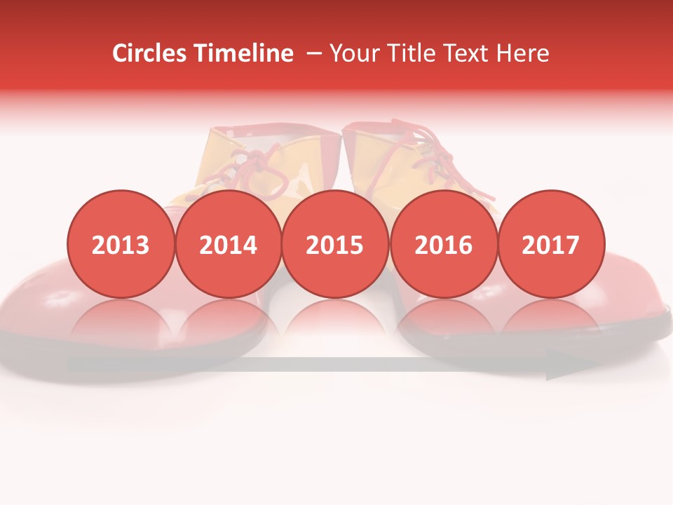 A Pair Of Huge Colorful Clown Shoes On A White Background With Copy Space PowerPoint Template