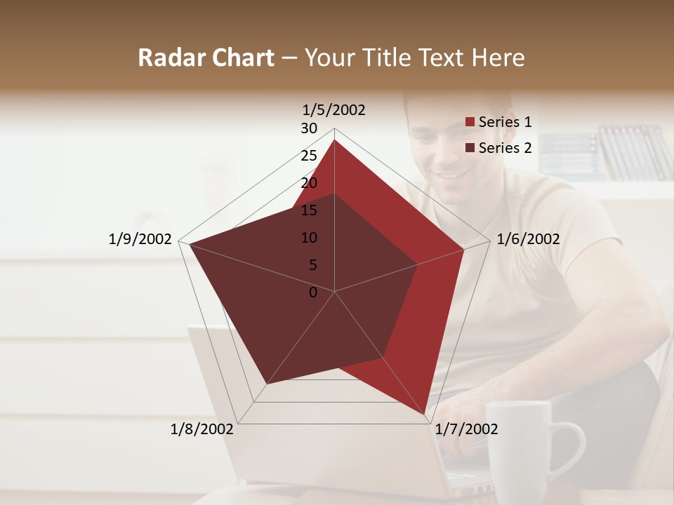 Happy Young Man In T-Shirt Sitting On Sofa At Home, Working On Laptop Computer, Smiling. PowerPoint Template