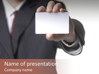 Businessman Holding Little White Card In His Hand PowerPoint Template