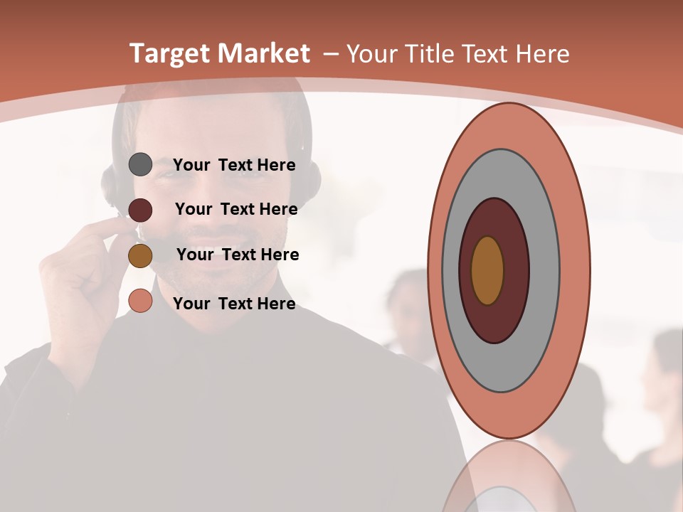 A Man Wearing A Headset With A Group Of People In The Background PowerPoint Template
