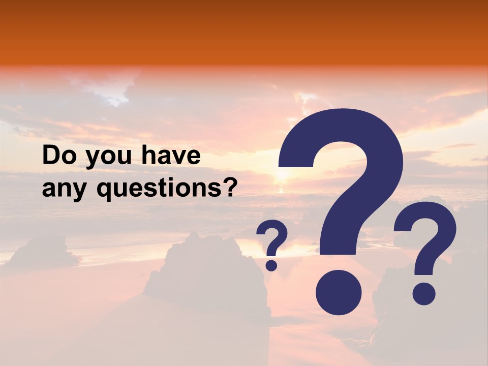 A Beautiful Sunset Over The Ocean With Rocks In The Foreground PowerPoint Template