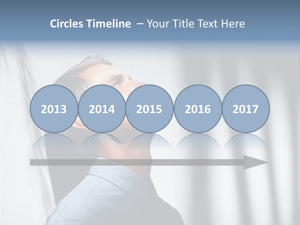 A Man In A Blue Shirt Is Looking Up PowerPoint Template