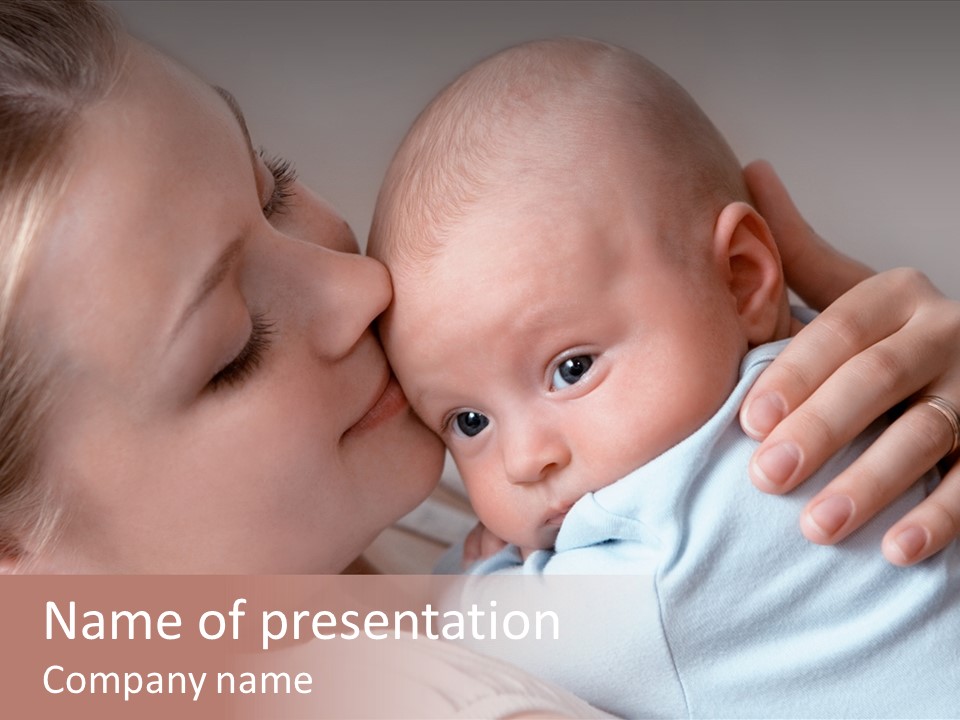 Beautiful Baby Of Three Months Old In His Mothers Hands. PowerPoint Template