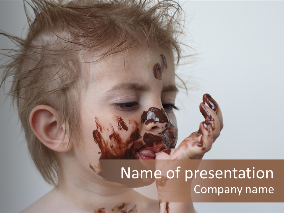 Baby With Face Covered In Chocolate PowerPoint Template