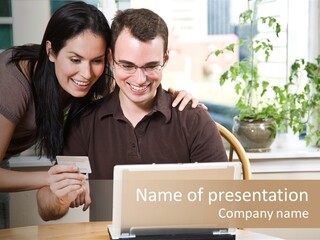 A Happy Couple Holding A Credit Card Shopping Online PowerPoint Template