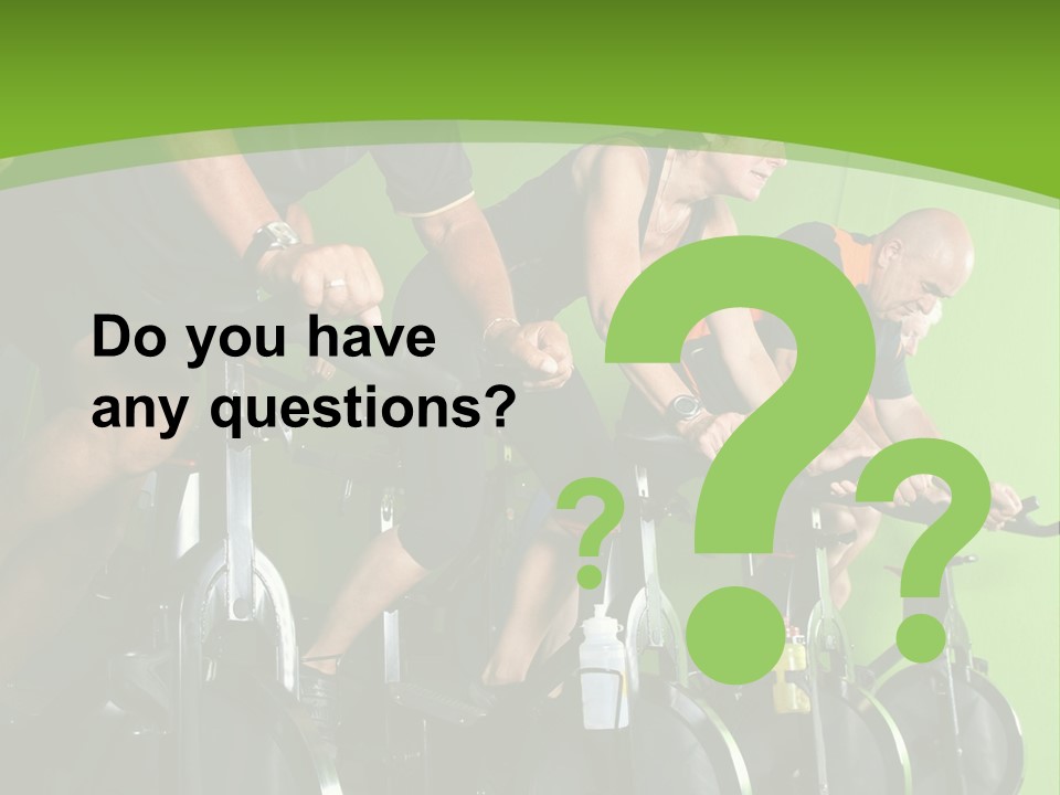 A Group Of People Riding Stationary Bikes In A Gym PowerPoint Template
