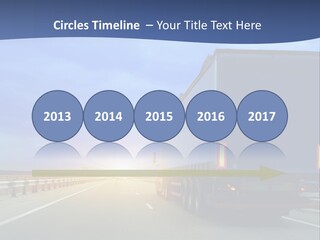 A Semi Truck Driving Down A Highway At Sunset PowerPoint Template