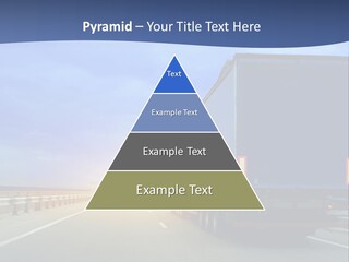 A Semi Truck Driving Down A Highway At Sunset PowerPoint Template