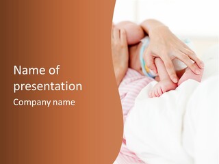 Hands Holding A Newborn Baby In Bed In Hospital PowerPoint Template