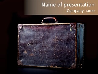 Old Suitcase Isolated On Black Background PowerPoint Template