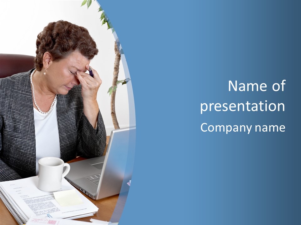 Mature Business Woman At Her Desk, Eyes Closed, Worried About Bills And Financial Problems PowerPoint Template