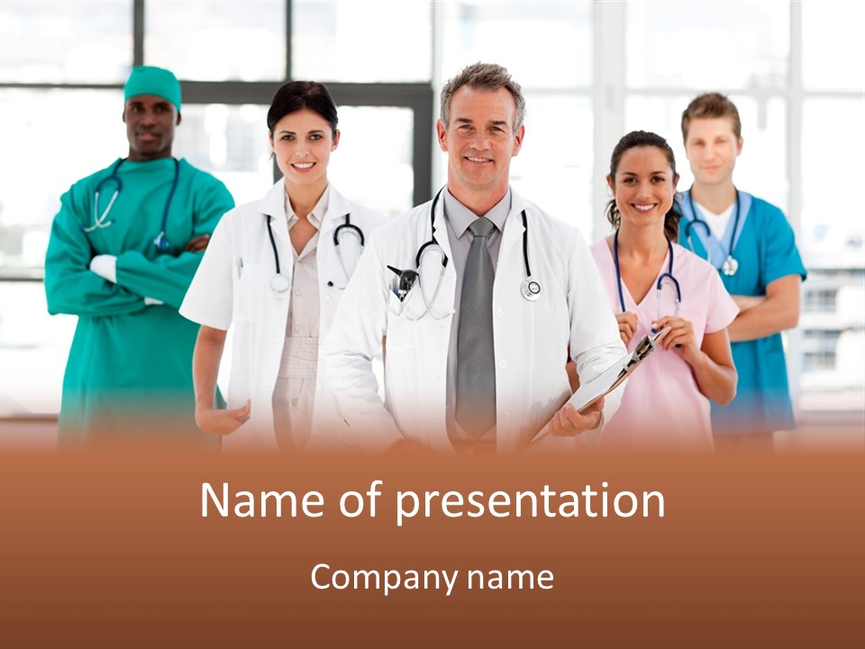 Smiling Medical Team Looking At The Camera In Hospital PowerPoint Template