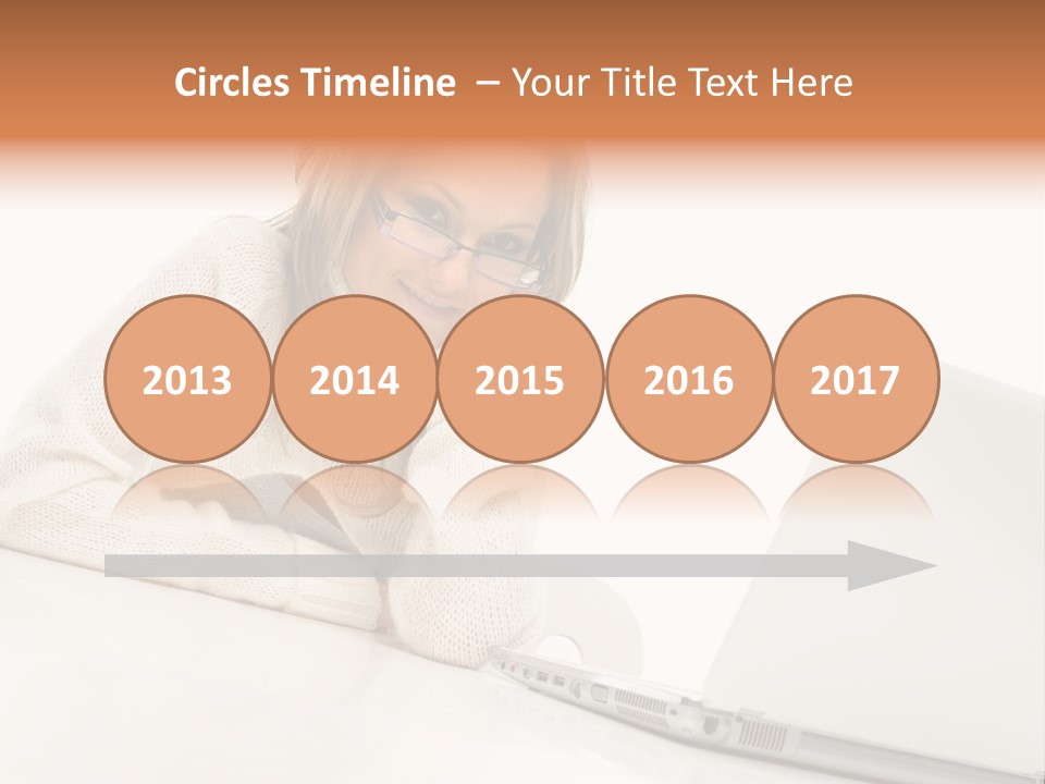 A Woman Sitting At A Table With A Laptop Computer PowerPoint Template