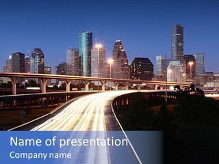 Lighted Houston Skyline Against Blue Sky PowerPoint Template