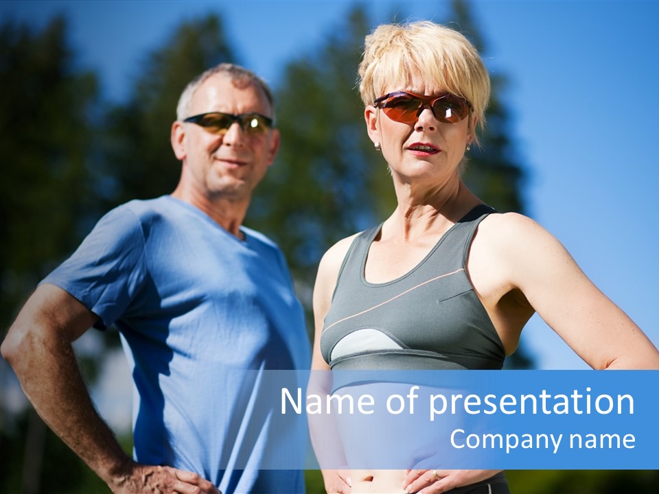 Mature Or Senior Couple In Jogging Gear Doing Sport And Physical Exercise Outdoors PowerPoint Template