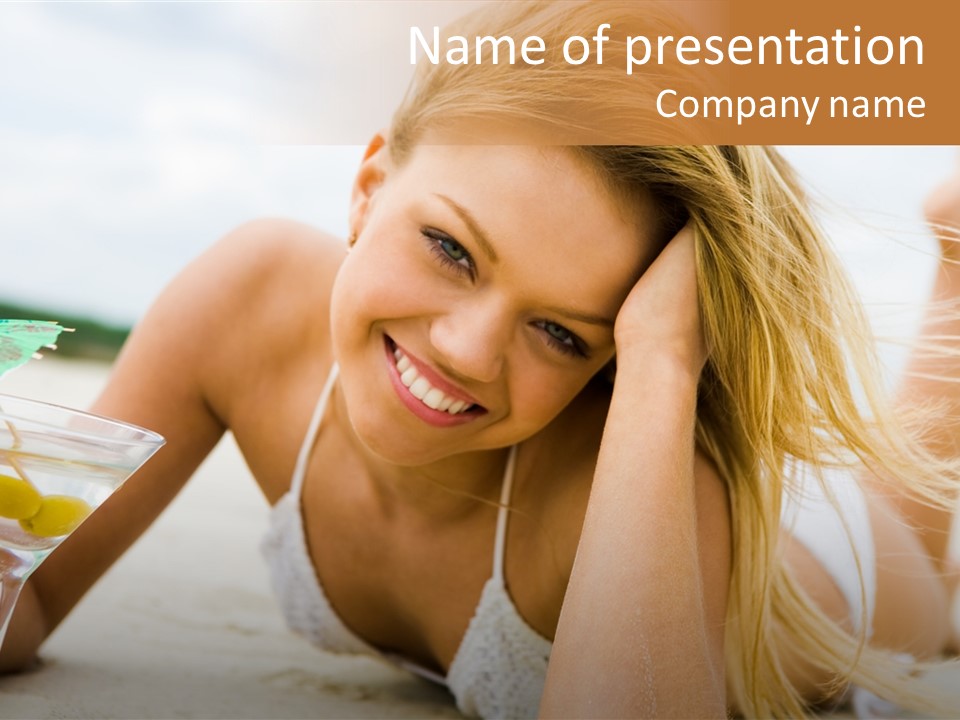 Image Of Pretty Girl With Martini Glass Lying On Sandy Beach And Looking At Camera PowerPoint Template