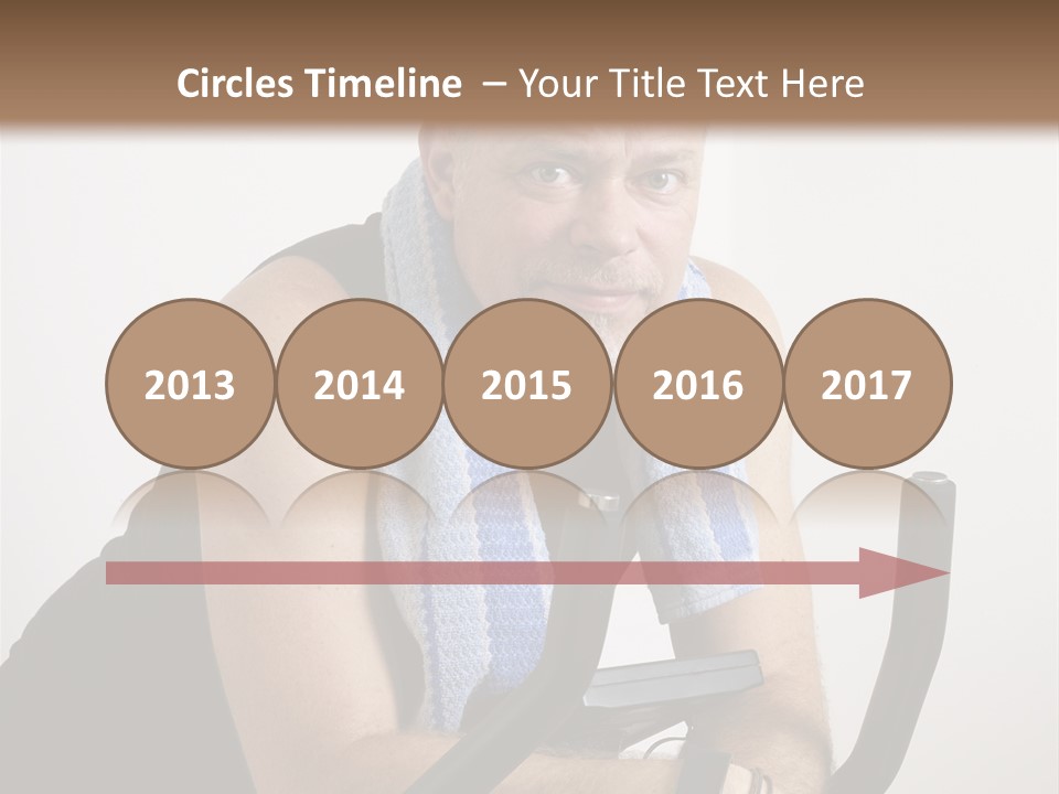 Man Excercising At Home On Bicycle PowerPoint Template