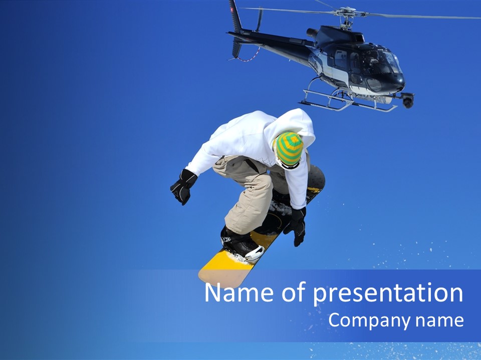 Filming With A Steady Cam Mounted On The Front Of A Helicopter Of A Snowboarder Jumping PowerPoint Template