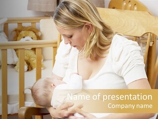Mother Breastfeeding Baby In Nursery PowerPoint Template