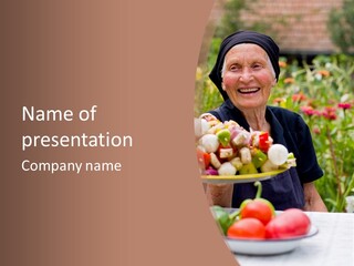 An Elderly Woman Laughing At The Table With Fresh Food In Her Hand. PowerPoint Template