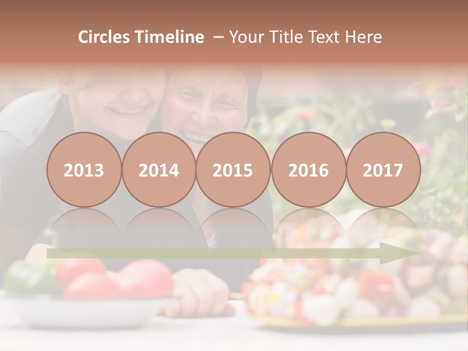 A Young Woman - Grandchild Or Carer - Next To An Old Woman At The Table, With Fresh Food In Front Of Them. PowerPoint Template