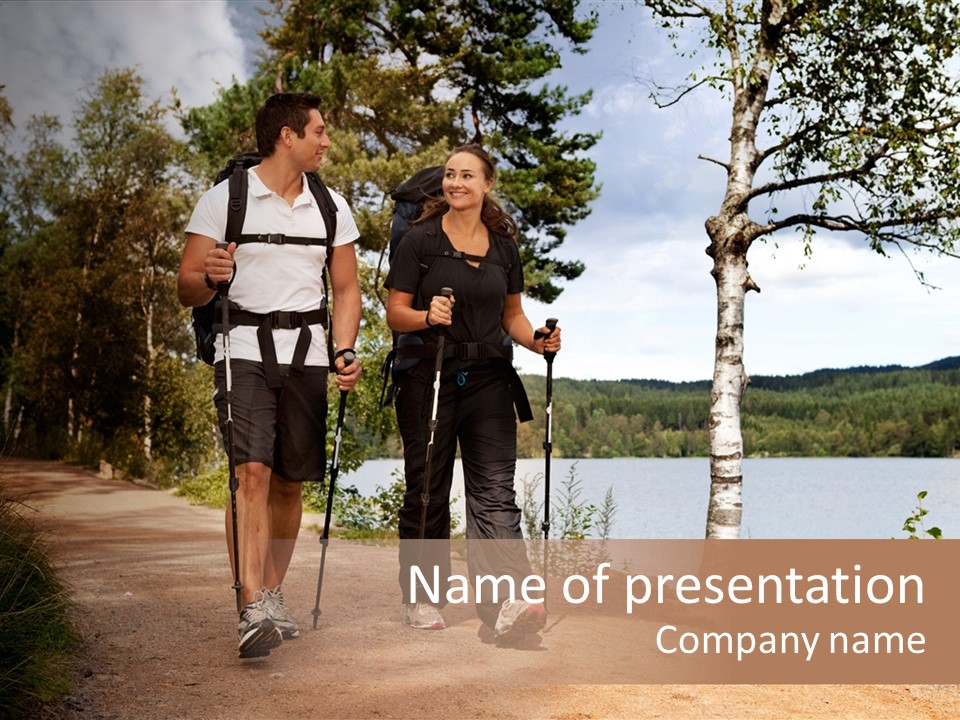A Couple Walking On Trail With Backpacks PowerPoint Template