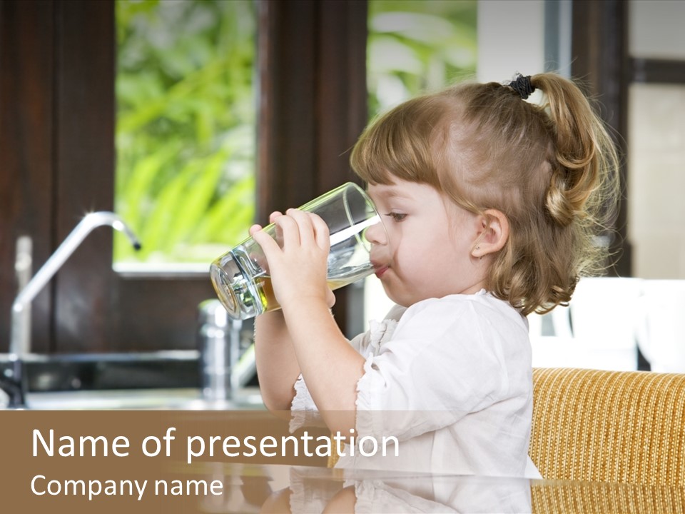 Portrait Of Little Girl Having Drink In Domestic Environment PowerPoint Template