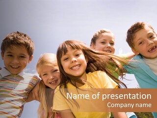 A Group Of Children Standing Together In A Circle PowerPoint Template