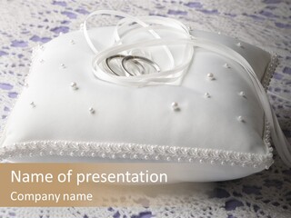 A Wedding Ring Pillow On A Lace Tablecloth PowerPoint Template