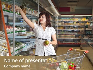 Beautiful Young Woman Standing With A Trolley At A Supermarket PowerPoint Template