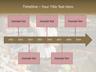 Beautiful Young Woman Standing With A Trolley At A Supermarket PowerPoint Template