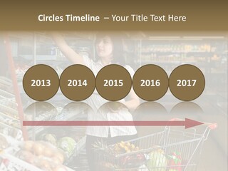 Beautiful Young Woman Standing With A Trolley At A Supermarket PowerPoint Template