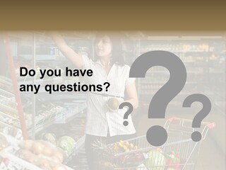 Beautiful Young Woman Standing With A Trolley At A Supermarket PowerPoint Template