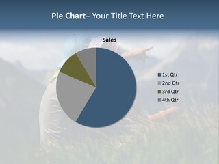 A Couple Of People Sitting On Top Of A Grass Covered Field PowerPoint Template