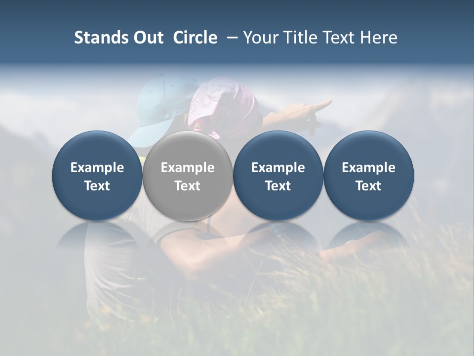 A Couple Of People Sitting On Top Of A Grass Covered Field PowerPoint Template