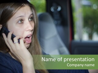 A Woman Talking On A Cell Phone In A Car PowerPoint Template